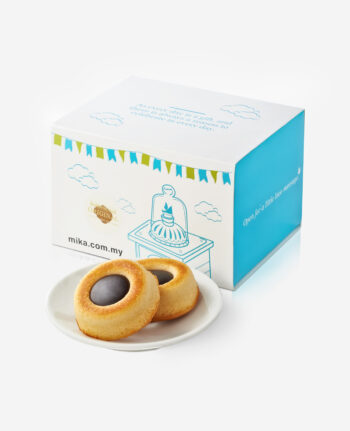 White and blue cookie gift box with two round cookies on a small plate in front. The box has clouds and banners and a site URL on the side (mika.com.my).